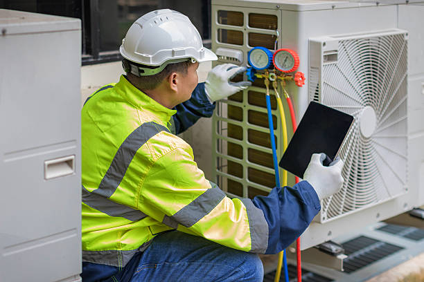 Professional Air Conditioning Repair technician working in Tyngsboro, MA